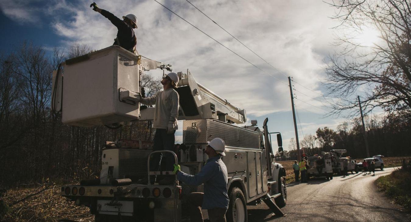 Linemen working by roadside