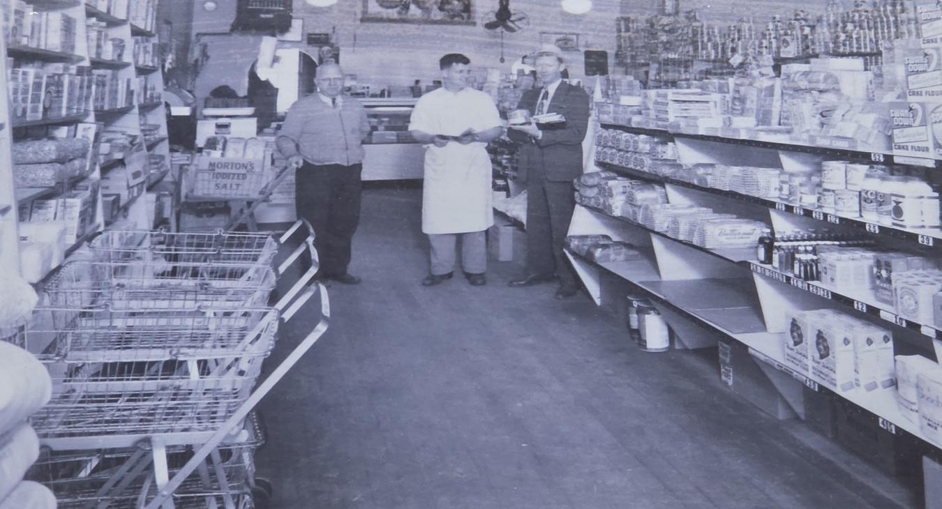 An early photo of Gust Nelson at one-room mercantile in the early 1900s.