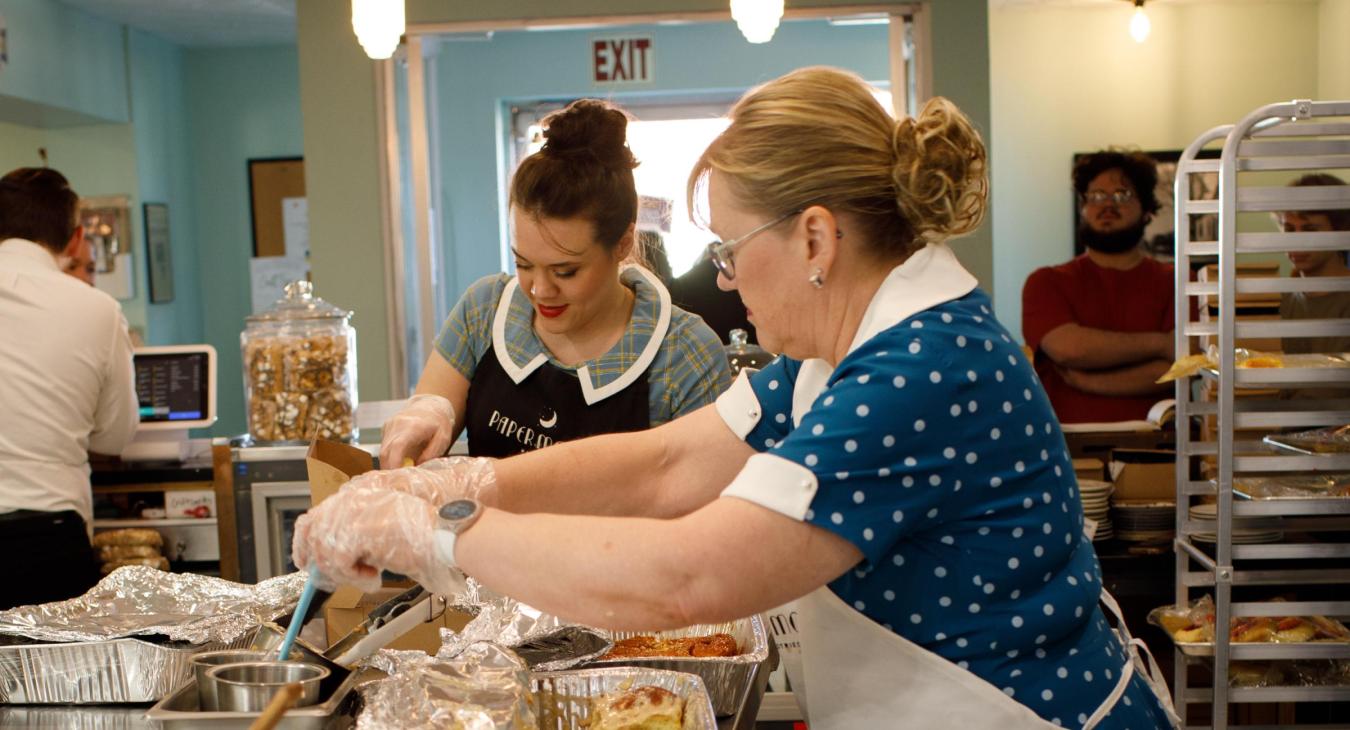 Lindsey Oelling and her mom, Lori, serve up warm cinnamon rolls on a busy Saturday morning.