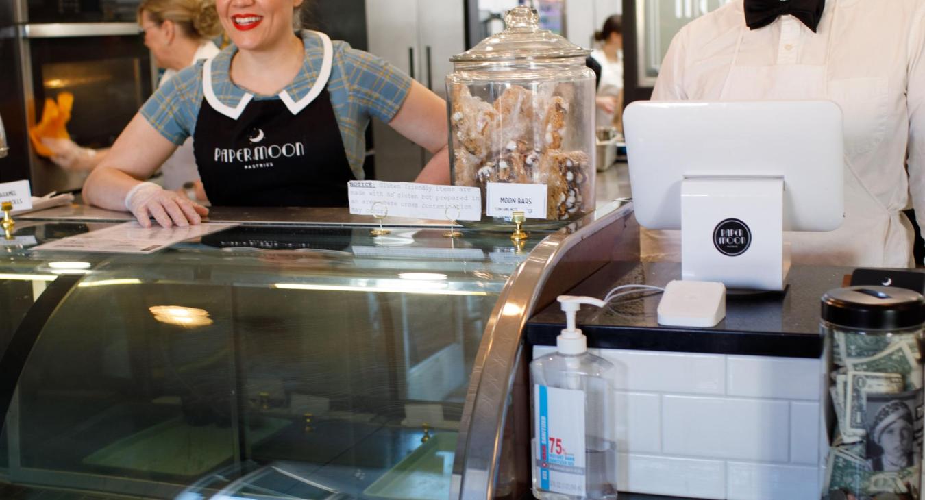 Lindsey Oelling greets customers of Paper Moon Pastries in Cortland, Nebraska.